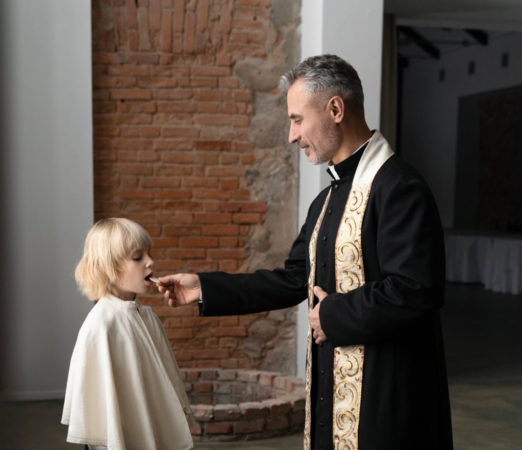 holy-communion-concept-with-kid-priest-full-shot (1) (1) (1)